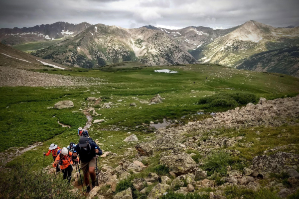 Members of the Walking Mountains Hiking Club climbing the slopes of Mt. Huron in the Sawatch Mountain Range, near Leadville-600x400